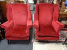A pair of mid 20th century fireside chairs upholstered in a red dralon