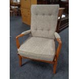 A 20th Cintique century teak framed armchair