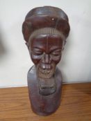 A 20th century African carved bust of a bearded man,