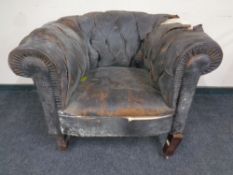 A 19th century leather upholstered club armchair (as found)