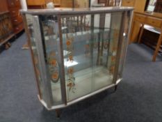 A mid 20th century melamine display cabinet