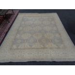 A Persian design carpet on beige ground,