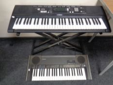 A Yamaha EZ-220 electric keyboard on stand and a Technics XK-K200 keyboard CONDITION