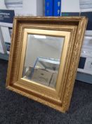 A gilt and gesso framed mirror