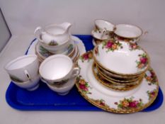 Two six-person table settings of Royal Albert Old Country Roses,