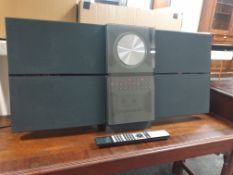 A Bang & Olufsen Beosound Century together with a wall bracket,