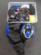 A box of motorcycle equipment, gloves,