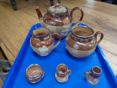 A three piece Royal Doulton silver rimmed tea service and three further similar pieces