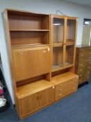 A 20th century teak G-Plan cocktail display unit fitted cupboards and drawers beneath