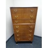 A 20th century teak G-Plan E Gomme seven drawer chest