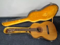 An acoustic guitar with label Giannini made in Brazil in hard carry case