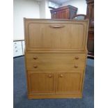 A 20th century bureau in a teak finish