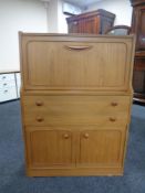 A 20th century bureau in a teak finish