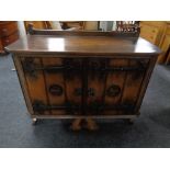 A 20th century oak double door cabinet