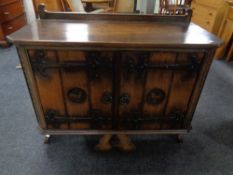 A 20th century oak double door cabinet