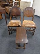 A small drop leaf table together with a pair of 19th century carved beech and studded leather