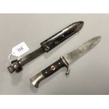 A German 1933-1938 Hitler Youth knife by C Gustav Spitzer, Solingen, in metal scabbard.