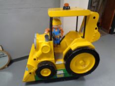A Bob The Builder coin operated ride on digger,