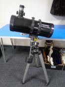 A Celestron power seeker 127EQ telescope on tripod stand with instruction manual