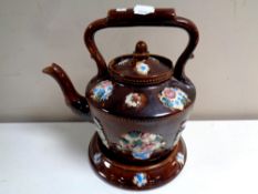 A 19th century barge ware teapot on stand