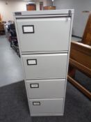 A Triumph four drawer metal filing cabinet with key