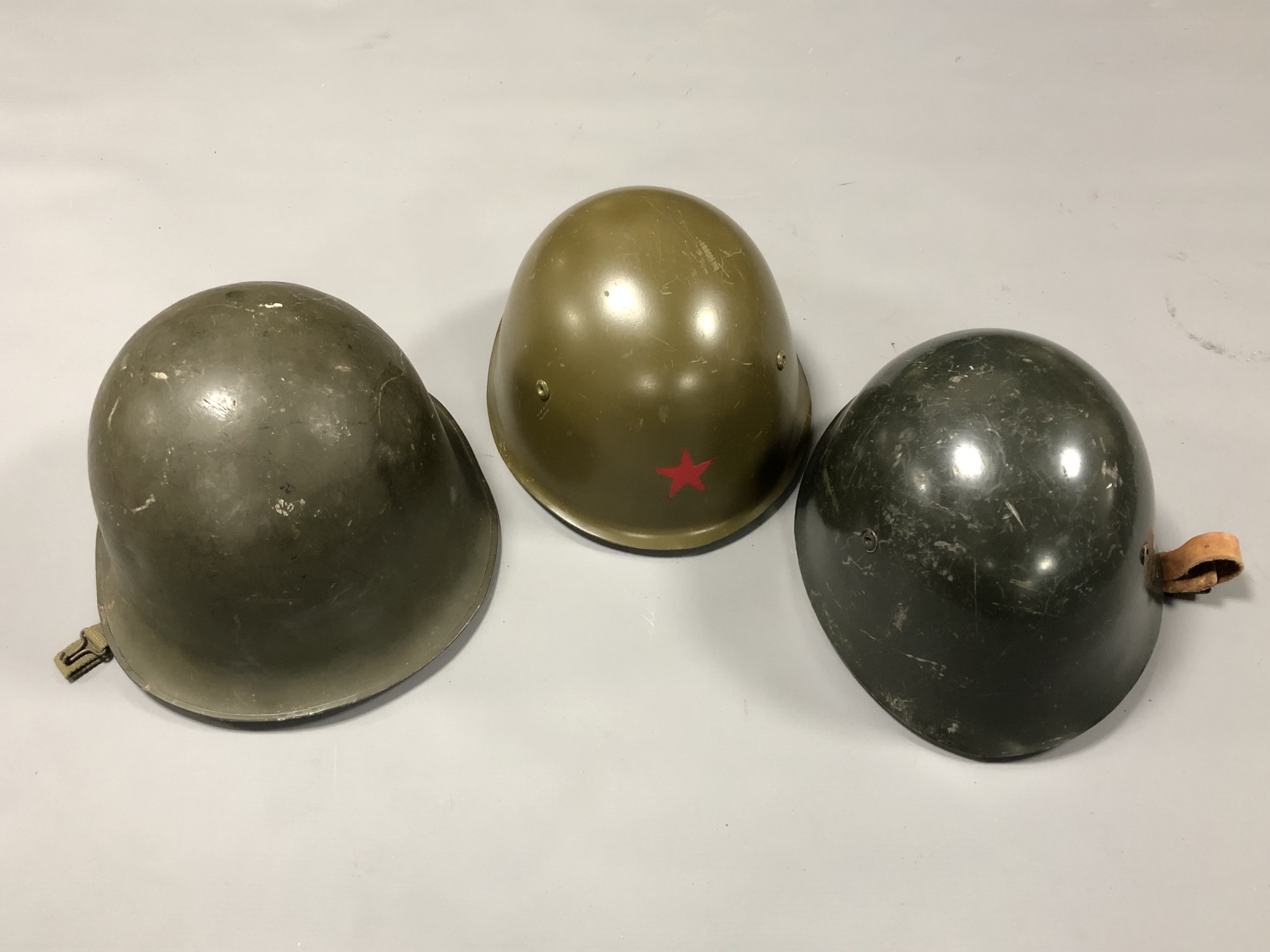 Three Soviet military helmets