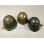 Three Soviet military helmets