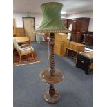 A carved beech barley twist standard lamp/occasional table with tasselled shade