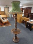 A carved beech barley twist standard lamp/occasional table with tasselled shade