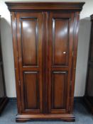 A contemporary mahogany effect two door wardrobe