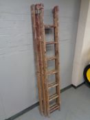 A triple wooden extension ladder