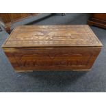 A carved sheesham wood blanket chest