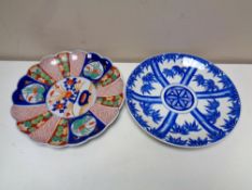 A Japanese Imari charger and a further blue and white charger