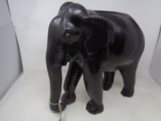 An ebonised wooden elephant figure