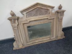 An antique painted cast iron overmantel mirror