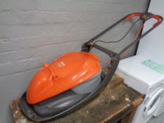 A Flymo Easi glide 300 electric lawn mower