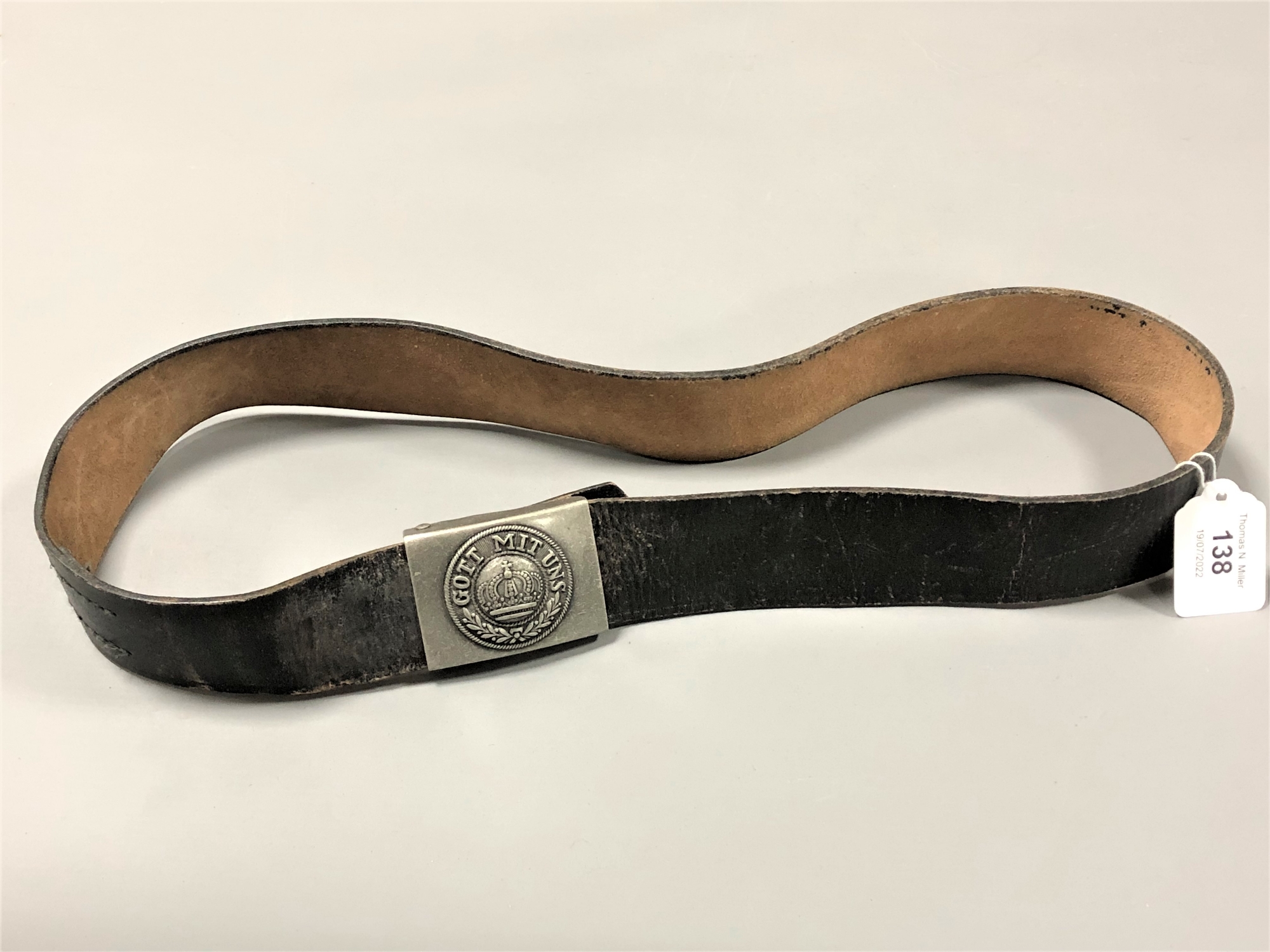 A leather belt with German steel buckle marked Gott Mit Uns (believed to be a copy)