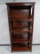 A mahogany effect open bookcase
