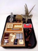 A tray of lighters including Ronson, pipes, pair of pocket binoculars, napkin rings,