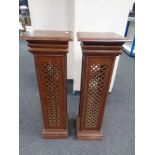 A pair of fretwork torcheres