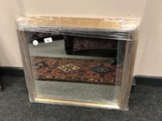 A plain golden framed contemporary mirror 60 cm x 55 cm