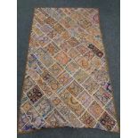 A patchwork wall hanging 170 cm x 100 cm