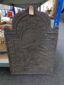 A 19th century cast iron fire back