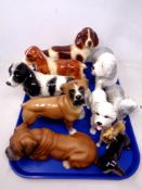 A tray of ceramic dog ornaments