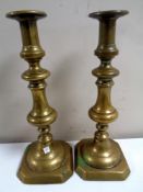 A pair of Victorian brass candlesticks