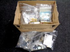 A box of unboxed and boxed military modelling kits, decals,