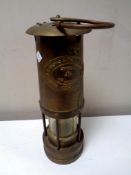 A brass E Thomas & Williams miner's lamp