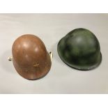 A 20th century Asian military helmet together with a Soviet example