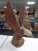 A wooden carving of an eagle