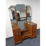 An Art Deco walnut sunk centre dressing table with triple mirror back